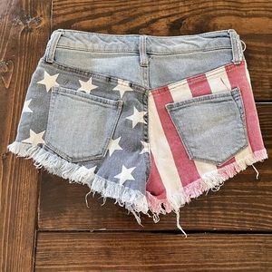 Size 00 / 24 Mossimo Supply Co light blue jean shorts w/ red white and blue flag
